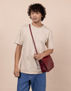 Ruby Leather womens handbag. Square shape with an adjustable strap. Model product image