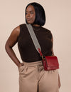 Ruby Leather womens handbag. Square shape with an adjustable strap. Model product image