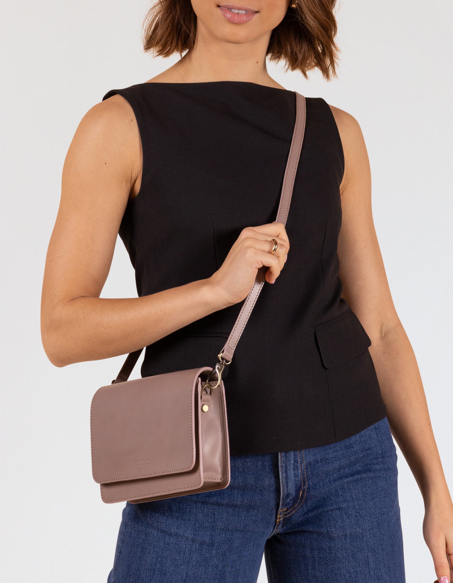 Model wearing Audrey Mini bag in mauve