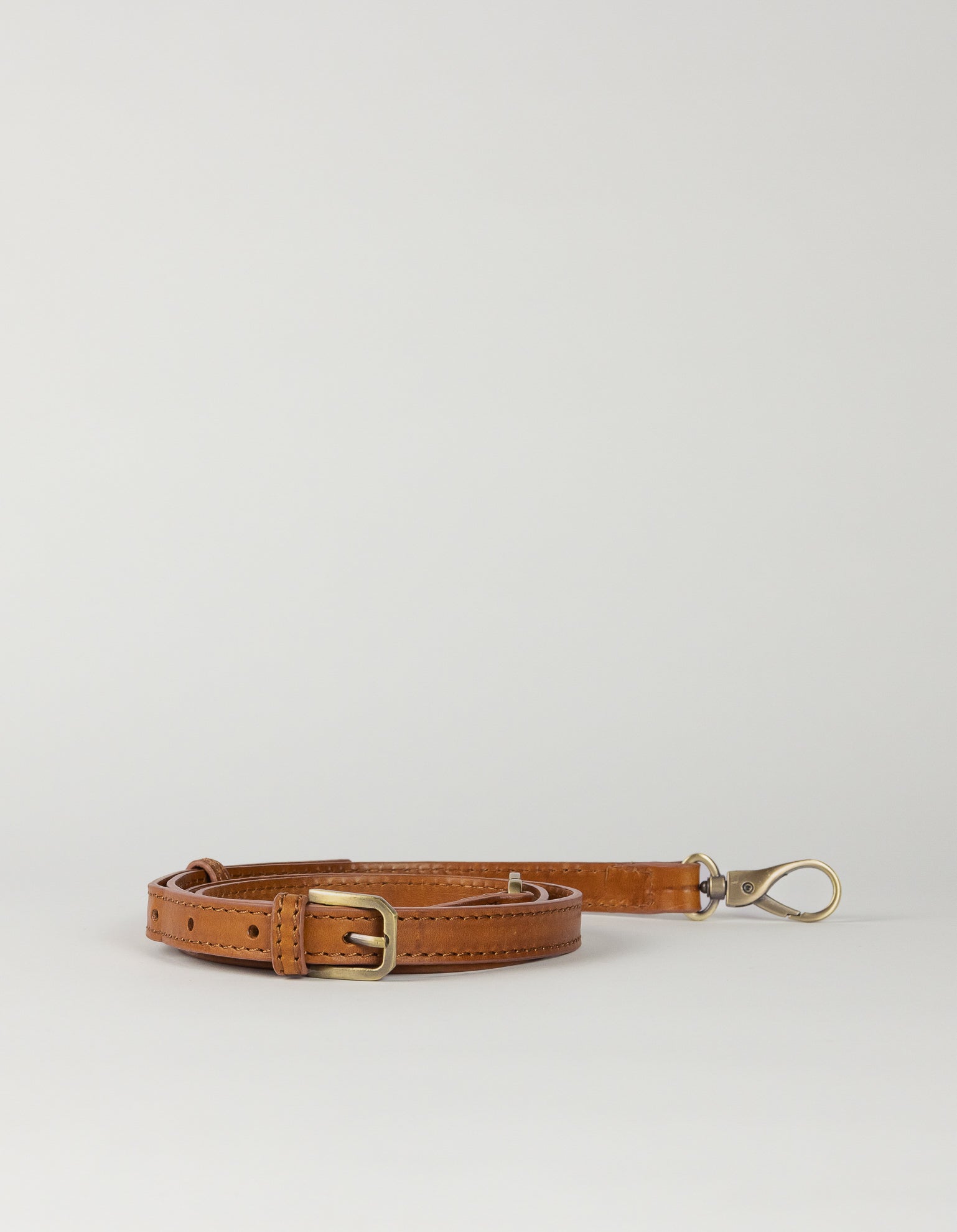 Cognac leather crossbody strap, rolled