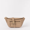 Front view of Drew Bumbag in Sand coloured leather with the leather strap