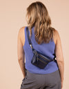 Model image showcasing Beck's Bum Bag midnight blue classic leather fanny pack with adjustable leather strap