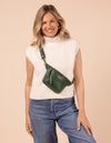 Model image showcasing Beck's Bum Bag pine green classic leather fanny pack with adjustable leather strap