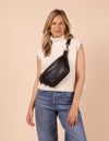 Model image of Drew Bum Bag black soft grain leather fanny pack with adjustable leather strap