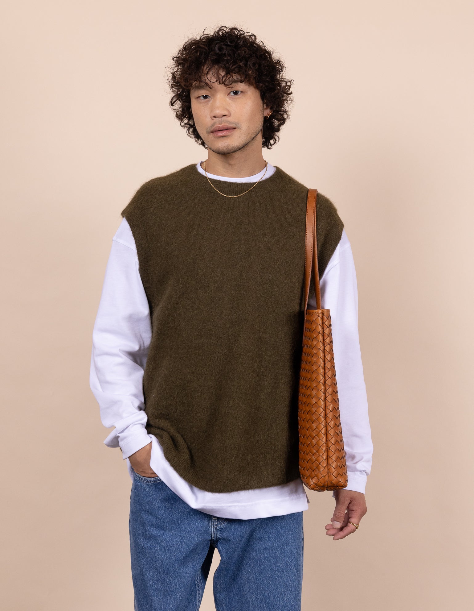 Model with Georgia bag in cognac woven classic leather