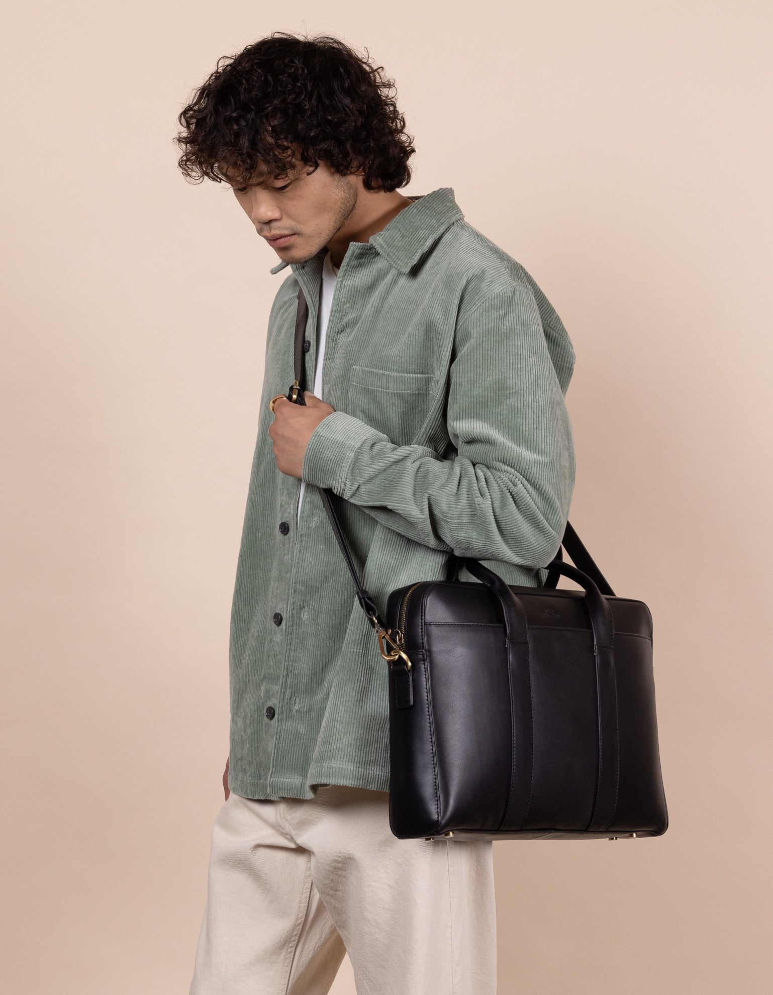 Black Leather business bag. Model product image.