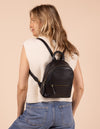 Model image showcasing Ivy black soft grain leather backpack