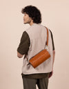Model with Izzy bag in cognac classic leather