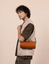 Model with Izzy bag in cognac classic leather