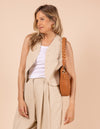 Model image showcasing Lana wild oak soft grain leather crossbody bag with braided shoulder strap