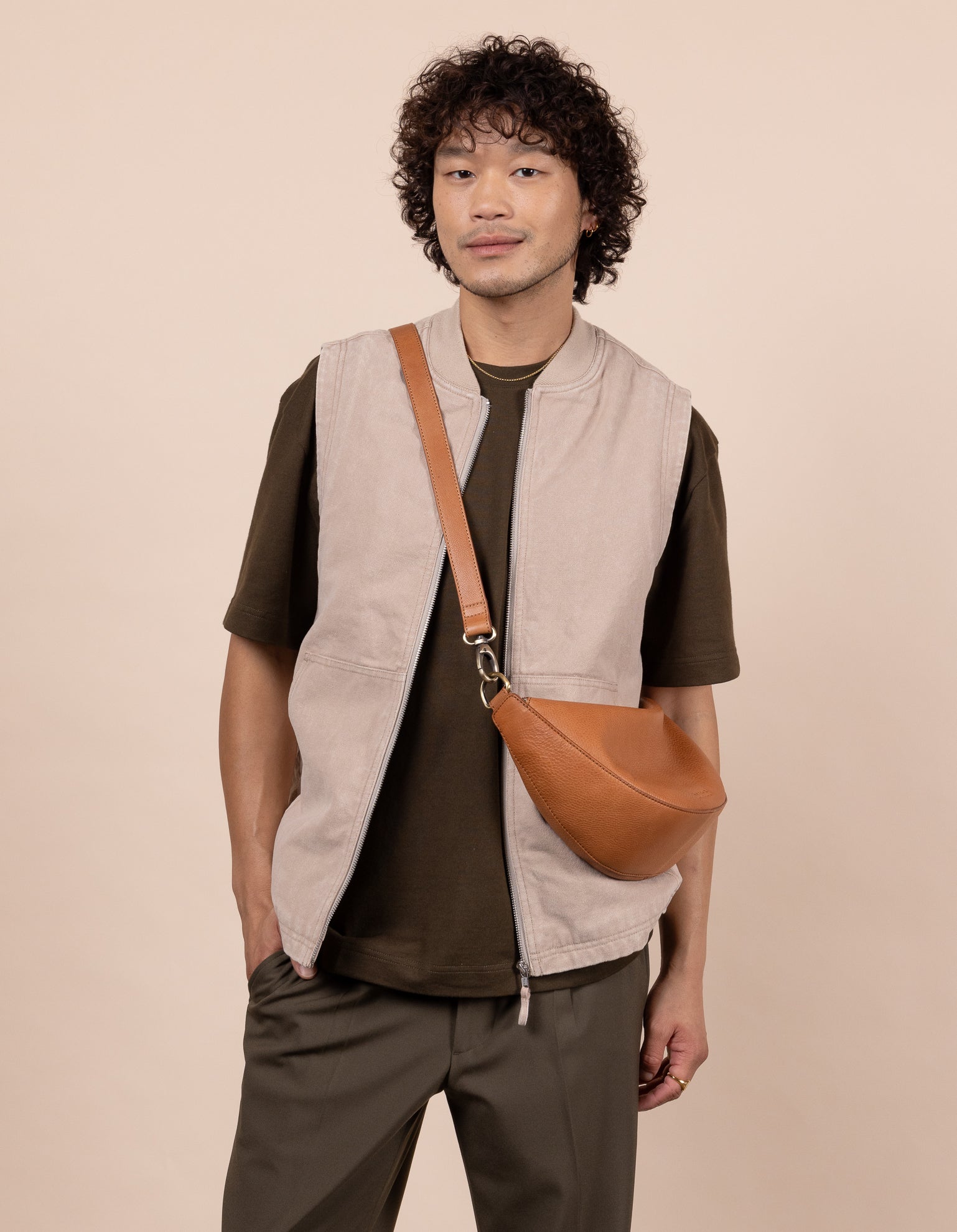 Male model with wild oak leather bag