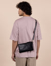 Male Model with Lexi bag in black woven classic leather