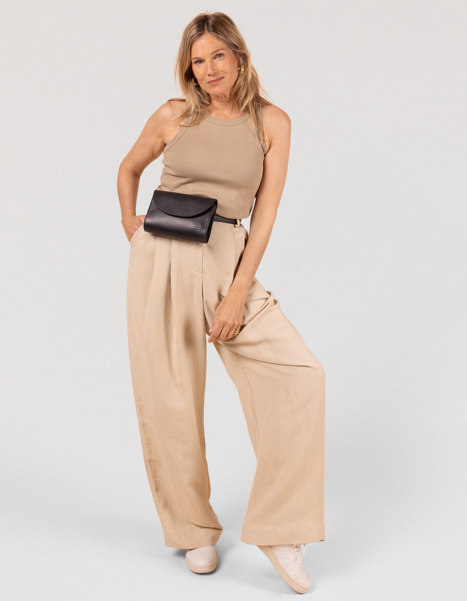 Black belt bag on a blonde model