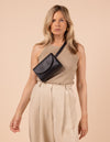 Black crossbody bag on a blond model