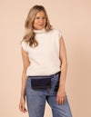 Ecom model image of blond woman model wearing a small navy belt bag