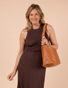 Model image showcasing Sienna wild oak soft grain leather crossbody work bag with braided shoulder strap