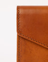 Cognac wallet. Envelope shape. Close-up image.