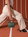 Campaign image of Nano Bag pine green classic leather crossbody bag