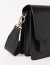 Harper Black Classic Leather. Accordion style midi crossbody bag. Product details close-up of hardware, dog hook, strap, and bag.
