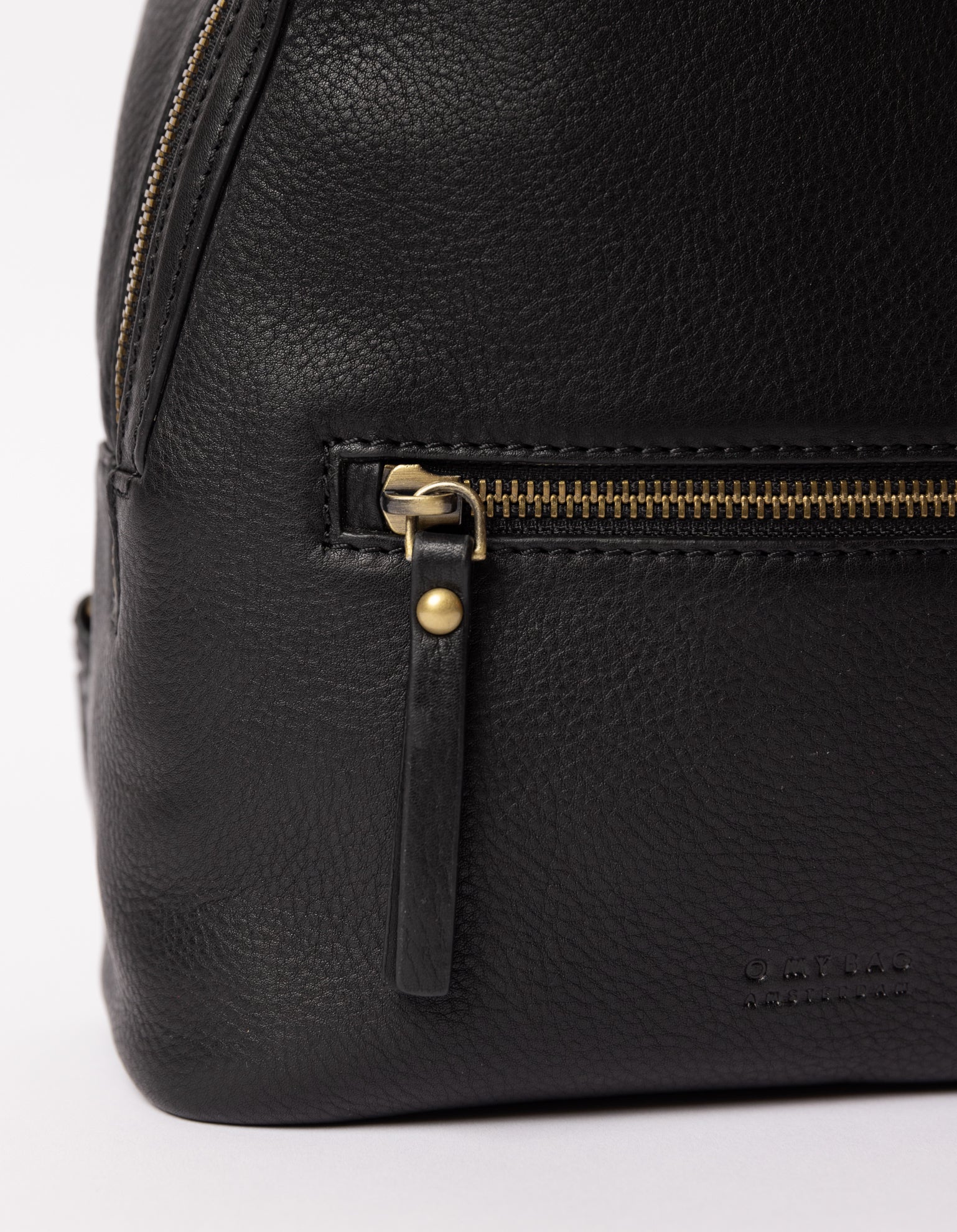 black backpack on white packground - close up of zipper handle