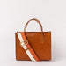 Front view of Jackie Midi in Cognac-coloured leather with strap