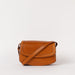 Front view of Kendalini in Cognac-coloured leather with strap