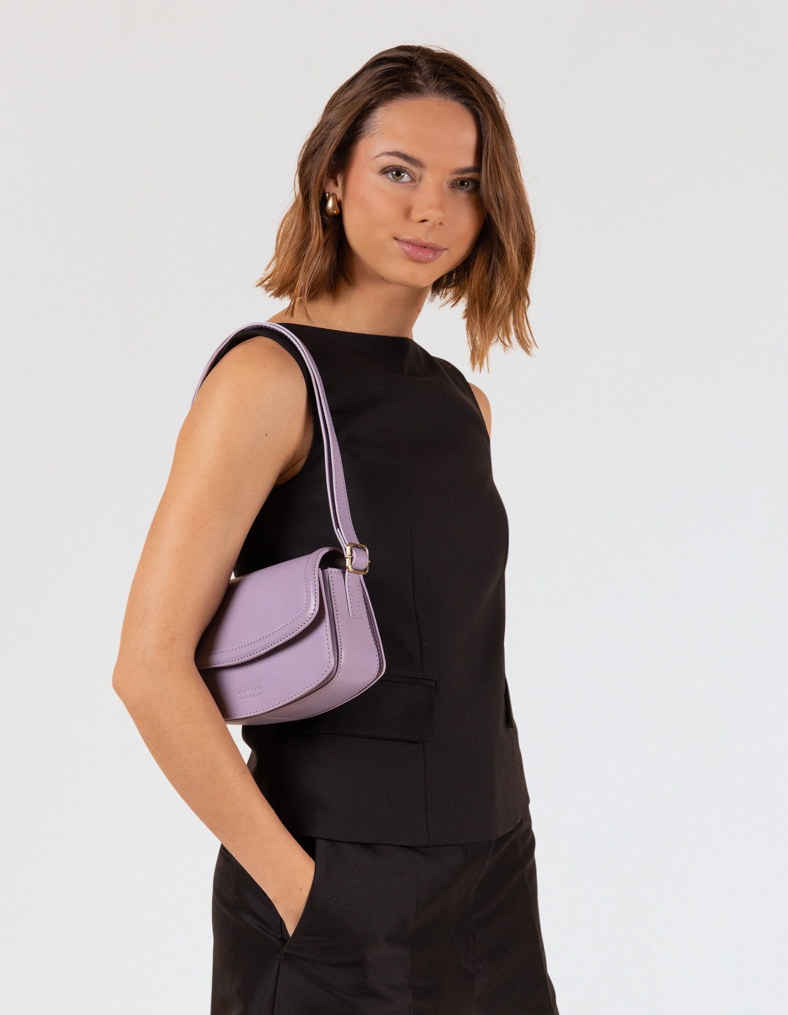 Model wearing Kendalini in Lavender-coloured leather 