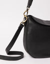 black bag on white background - close up of 2 straps hooked on bag