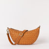 Front view of Leo in woven "wild oak"-coloured  leather with a strap
