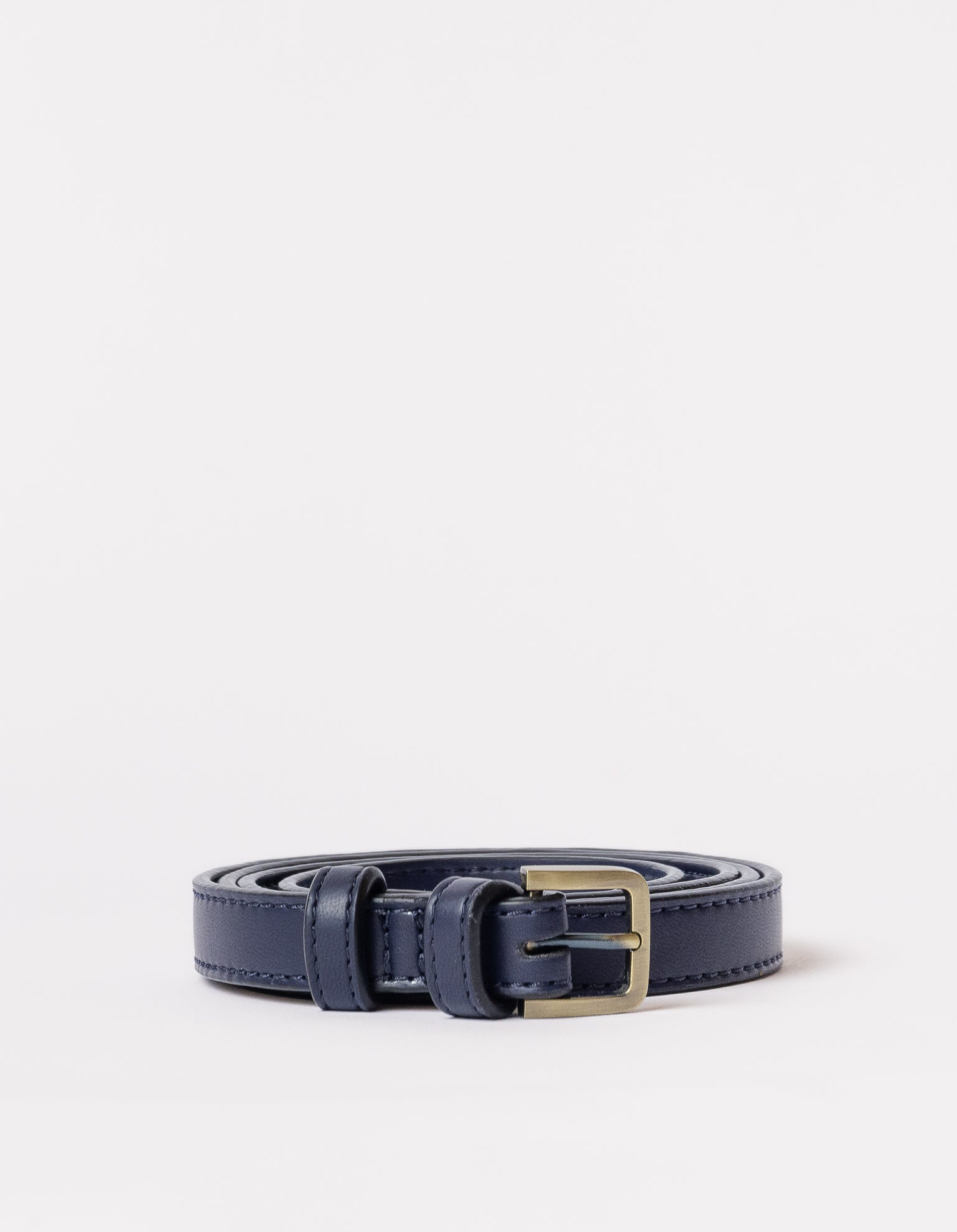 Rolled navy blue bag strap with buckle on white background