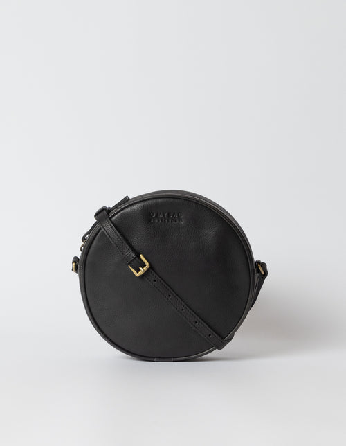 Luna Bag Black Soft Grain Leather. Circular crossbody bag for women. Front product image.