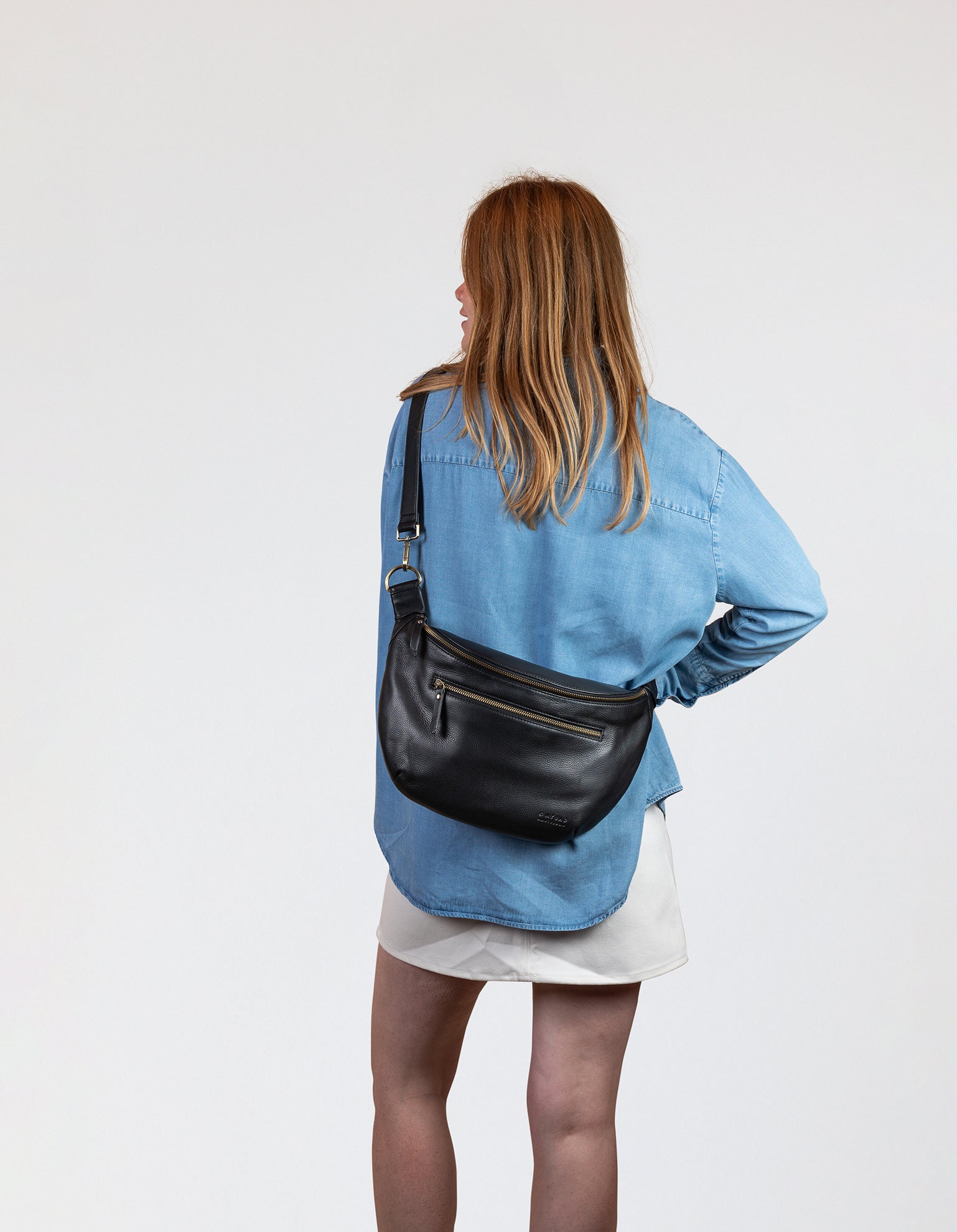 Drew Maxi Bum Bag in Black Soft Grain Leather - Model Image, back view