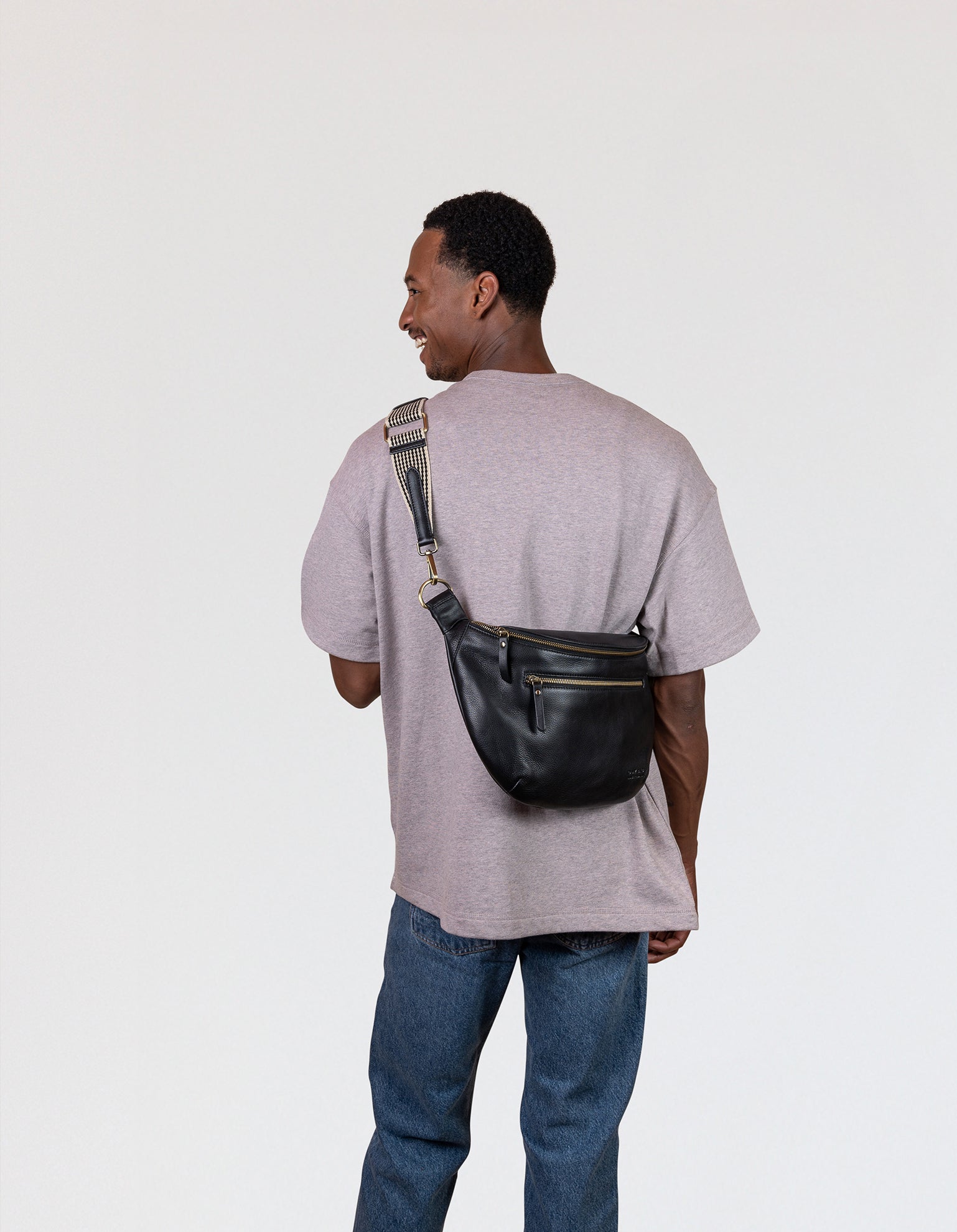 Drew Maxi Bum Bag in Black Soft Grain Leather - Male model Image, back view