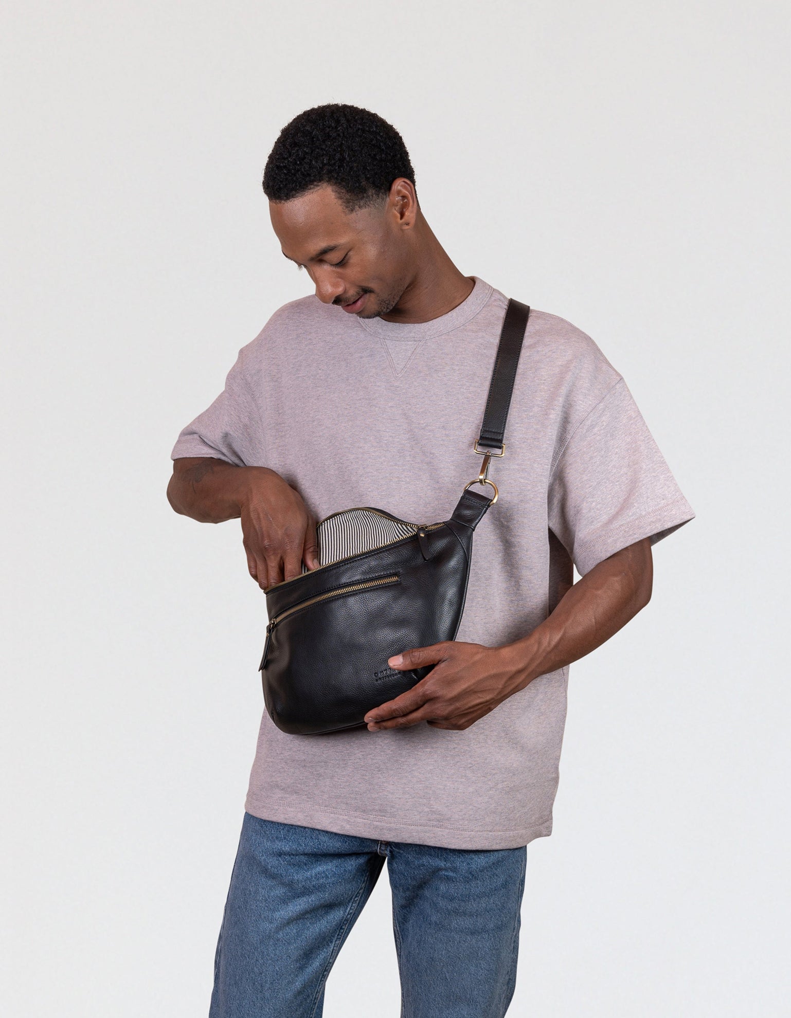 Drew Maxi Bum Bag in Black Soft Grain Leather - Male model Image, front view
