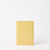 Front of Passport Holder in Butter Yellow Classic Leather