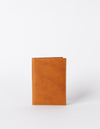 Passport Holder Cognac Classic Leather. Small rectangular passport holder for travelling. Front product image.