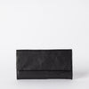 Pau Pouch Black Leather women’s purse. Rectangular shaped fold over wallet. Front model image