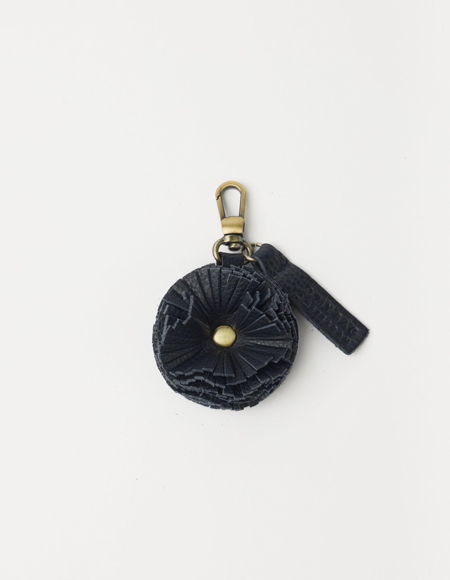 Blue keychain with decorative element on a white background
