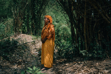 Image of indian woman standing in nature.