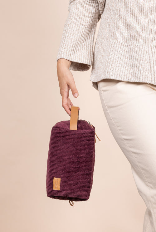 Model holding Ted Travel Case Large in Corduroy