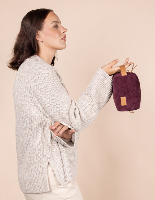 Model holding Ted Travel Case small in Corduroy