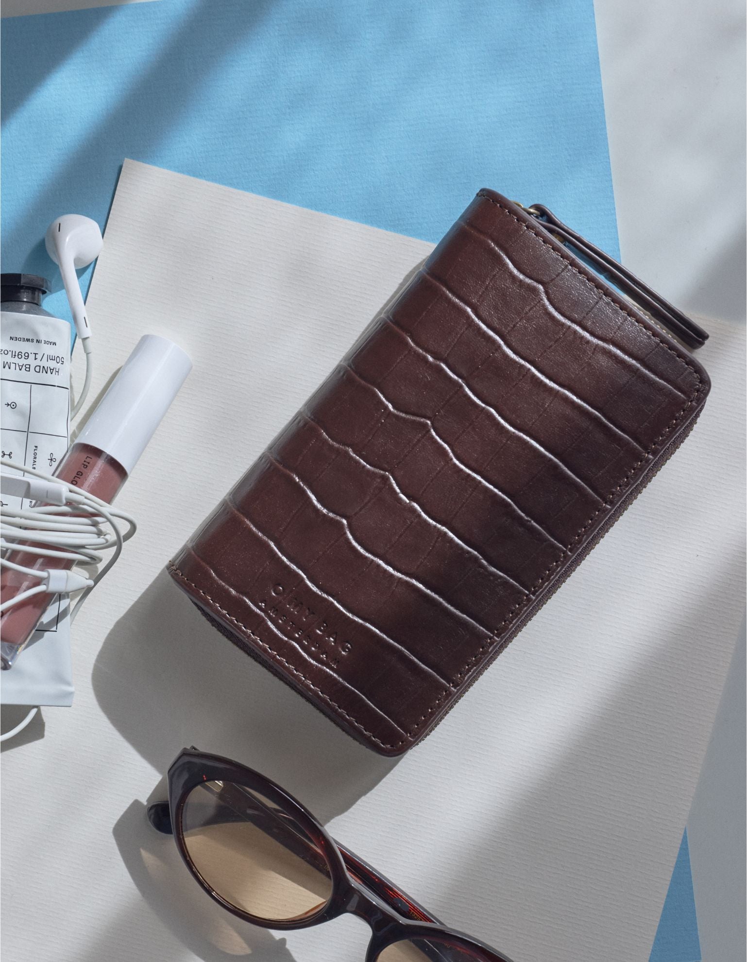 Jett Wallet - Dark Chocolate Croco Print Leather. Lifestyle Product Image.