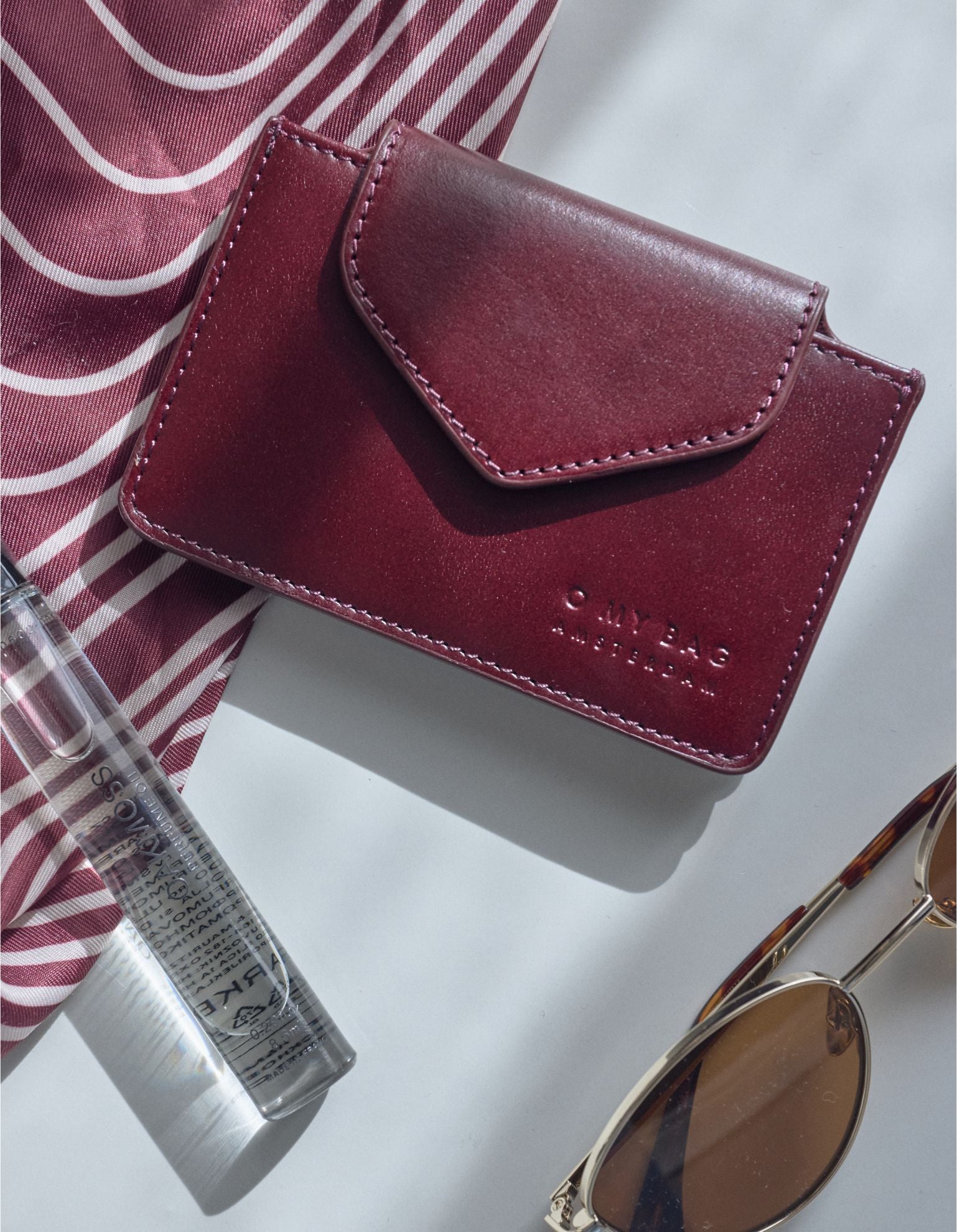 Harmonica Wallet Small Cherry Leather by O My Bag. Square shape. Lifestyle product image