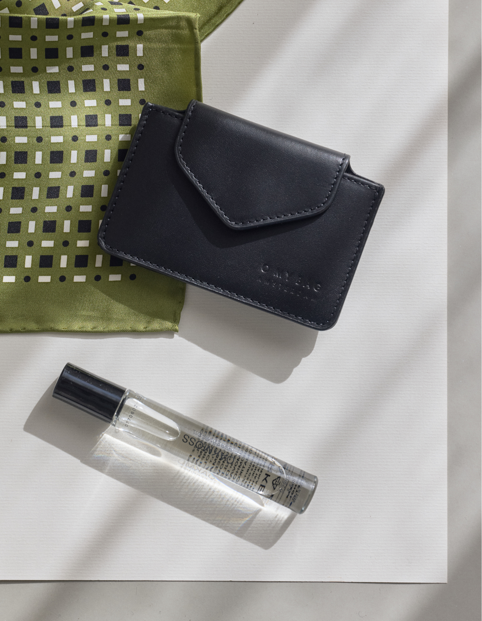 Harmonica Wallet Small Black Classic Leather by O My Bag. Square shape. Lifestyle image.