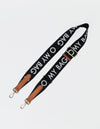 Canvas logo strap black with cognac classic leather - flat lay