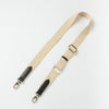 Organic cotton webbing strap in sand with black leather - Product image