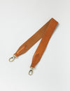 Cognac stromboli leather add-on handbag strap with webbing on one side. product image.