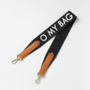 Black canvas cotton handbag strap with cognac leather details and logo print. product image