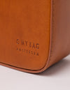 Vicky shoulder leather bag in cognac - close-up of logo
