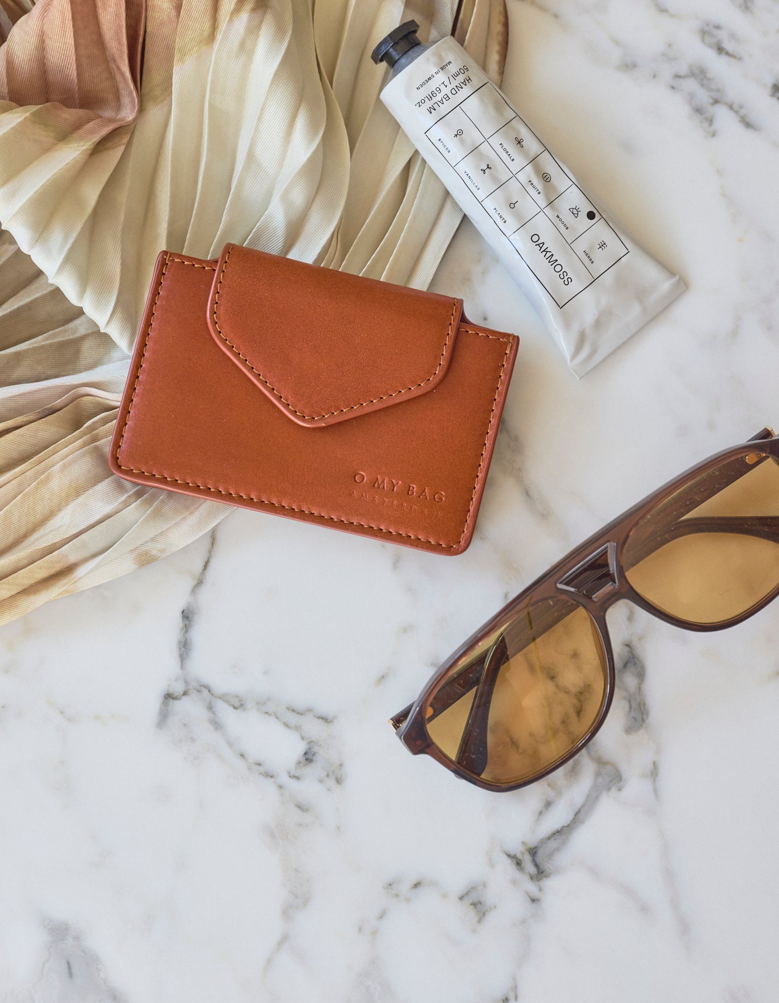 Harmonica Wallet Small Cognac Classic Leather by O My Bag. Square shape. Lifestyle product image